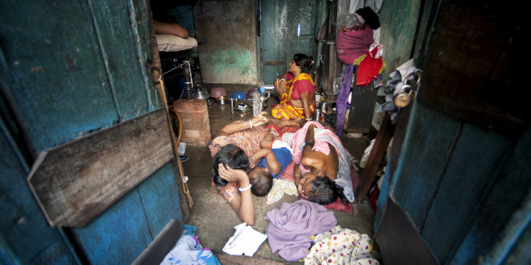 A family living in an urban slum in Sonagachi.