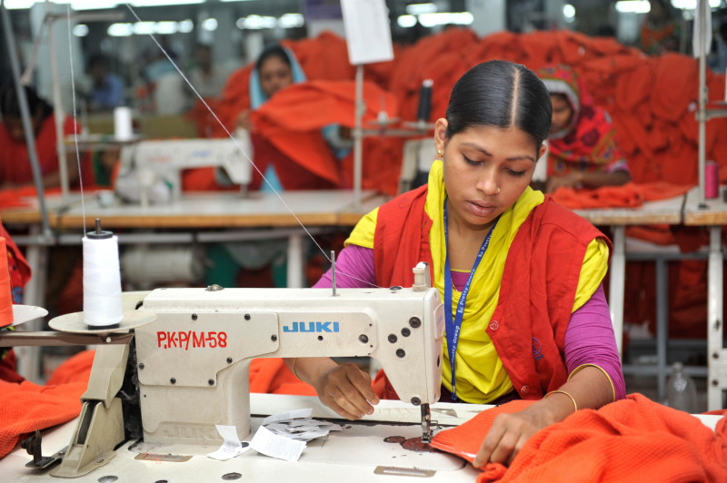 Gajipur, Bangladesh - November 2, 2013: Bangladesh clothing and garment factories are often filled with hundreds of female laborers who work long shifts for, often, low wages. When Bangladeshi women are separated from their husbands or are being divorced,