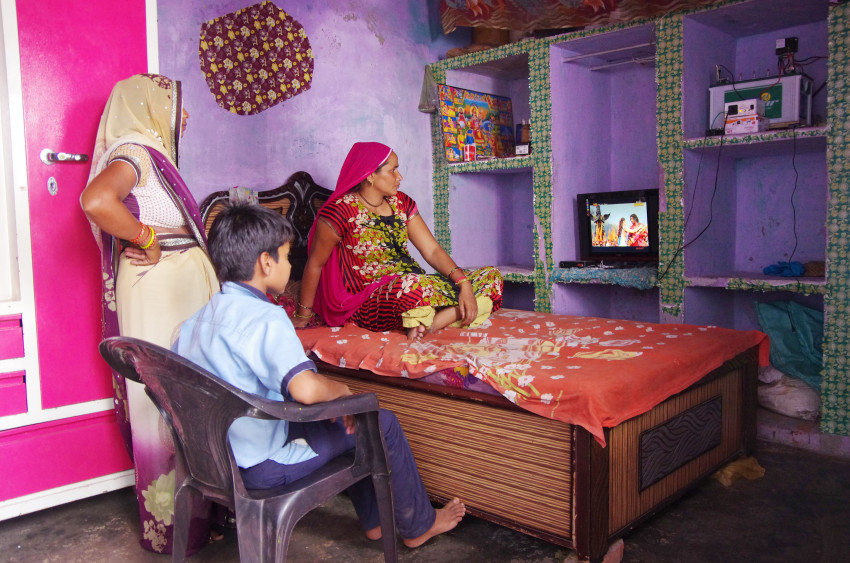 Rural household enjoying solar TV in the comfort of their homes