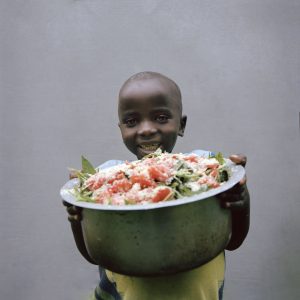 5-year-old son Clément is alive today thanks to the support he received from a Maman Lumière (Light Mother). After being diagnosed as malnourished at just 17 months old, Clément and his mum Clotilde attended a series of Nutrition Sessions to learn new skills, receiving step-by-step instructions on food preparation and hygiene from a Maman Lumière. Photo: Chris de Bode/Panos Pictures for Concern Worldwide