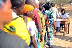 05 September 2012, Chamwino, Tanzania - Input trade fair hosted by the Chamwino District council and facilitated by FAO. For the first time 400 farmers from 5 villages were granted trade vouchers by FAO that enabled them to purchase the quality declared seeds and farm equipment from the agro dealers at the trade fair. A series of droughts in central Tanzania has challenged the food security of rural farmers and reduced the availability of quality seeds and crop varieties, increasing the level of poverty in the region. In response, The Food and Agriculture Organization (FAO) launched the Disaster Response and Preparedness to Drought project, funded by DFID, to provide the basic stock of quality declared seeds and support the farmers groups. By using seed-based response mechanisms and good agricultural practices, FAO and DFID are enhancing the capacity of farming communities to prepare for and respond to climate variability. FAO Project: OSRO/URT/001/UK - Emergency supply of maize seeds to drought-affected farmers in Tanzania /(New phase) Disaster Response and Preparedness to Drought. - 2012. Objectives: The general objective of this project is to provide emergency seed support to farming families in 34 districts affected by drought in order to avert food insecurity and possible starvation. The specific objective of this project is to distribute a total of 1 592 tonnes of seed to 159 200 food insecure households to cover an estimated 64 427 hectares of land with an expected yield of 96 640 tonnes of maize.