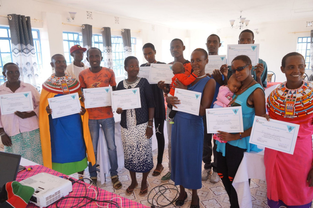 PCF workshop participants pose with their participation certificates
