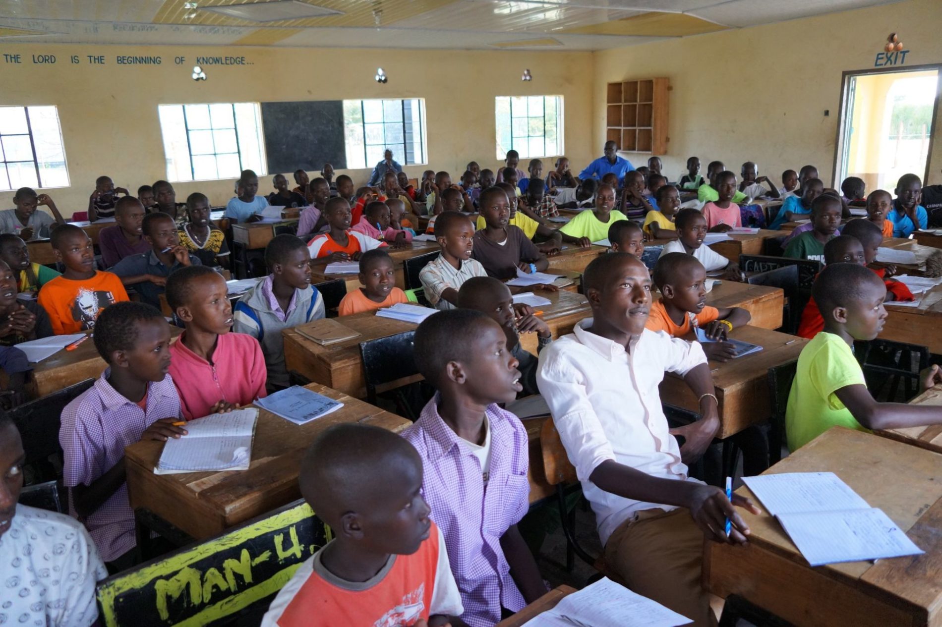 A group of men and boys take a workshop on gender-based violence