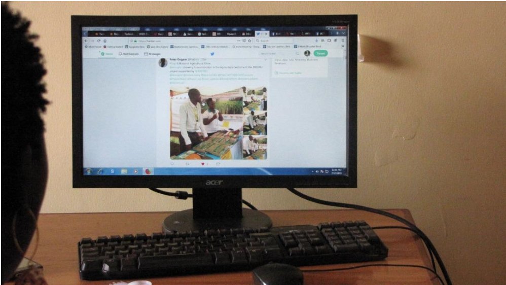 A young woman reading information shared on Twitter