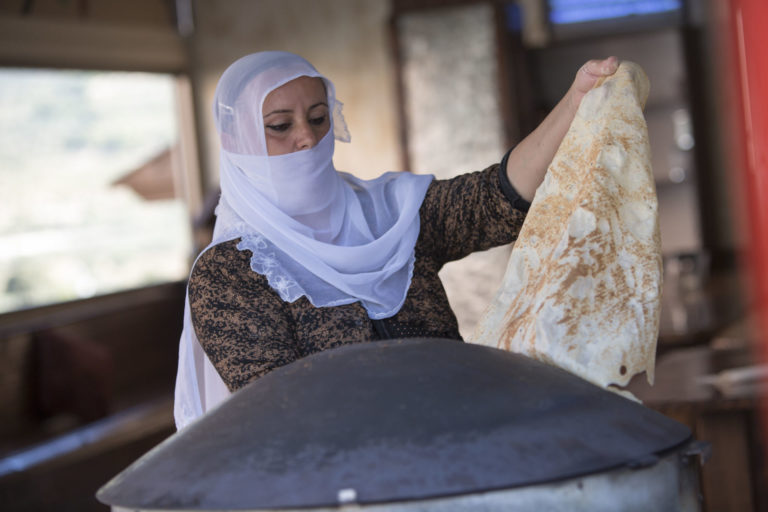 Druze woman baking