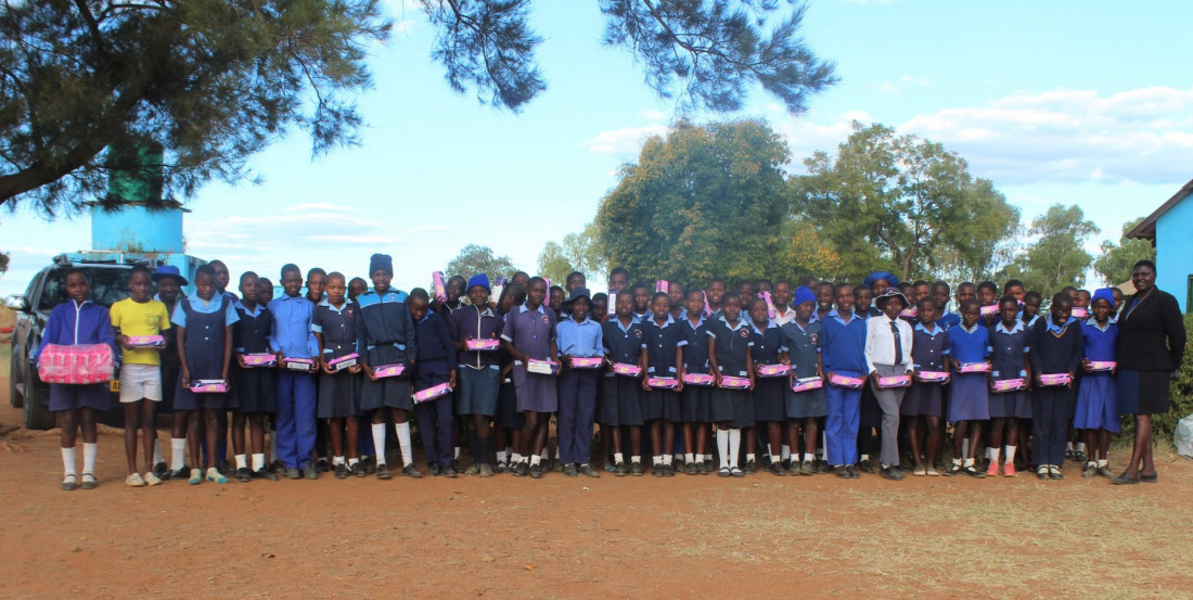 On International Hygiene Day, Shamwari Yemwanasikana donates sanitary pads to Jonasi primary school girls.