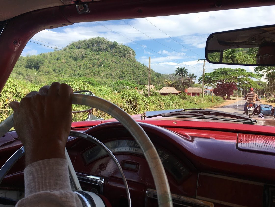 Lazaro's hand at the wheel