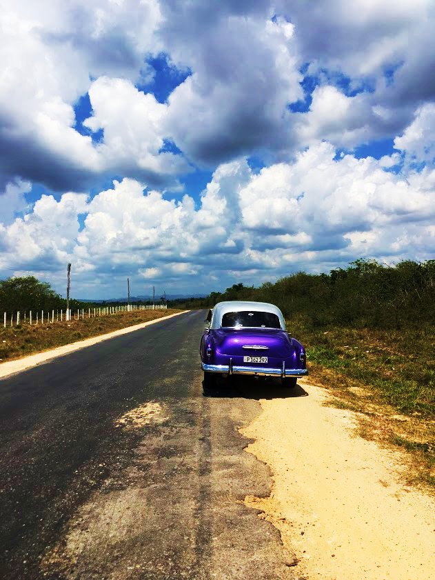 The purple vintage Chevrolet parked