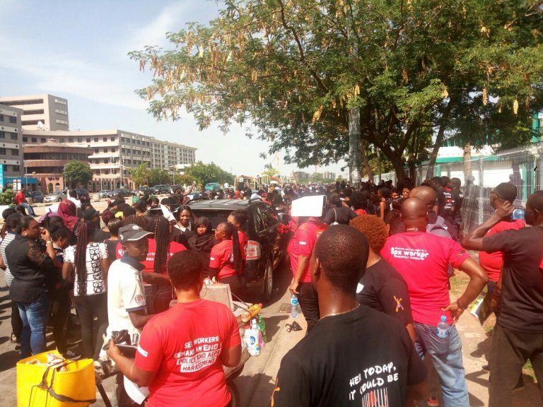 Men and women protesting the Abuja raid