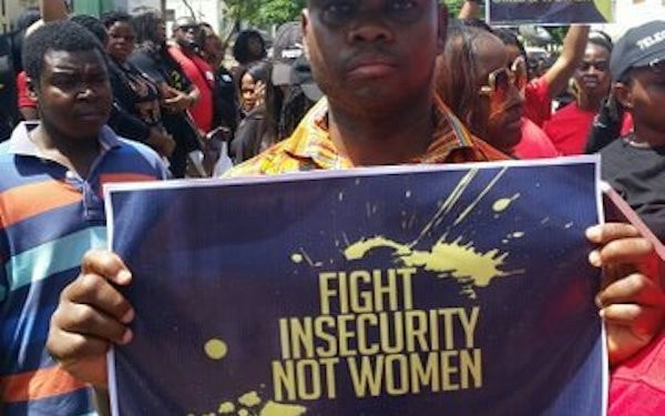 Men protesting the Abuja raid