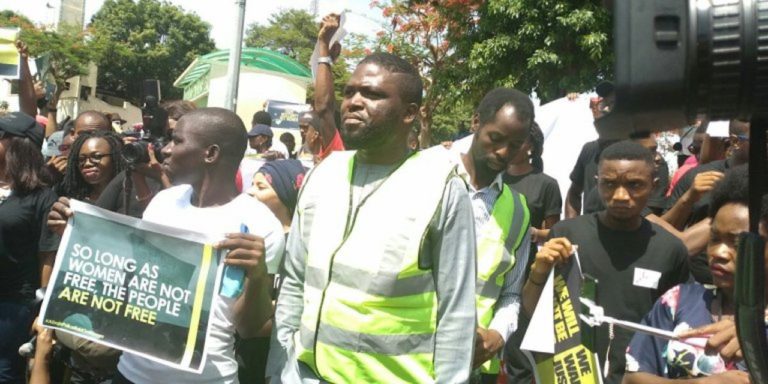 Men protesting the Abuja raid