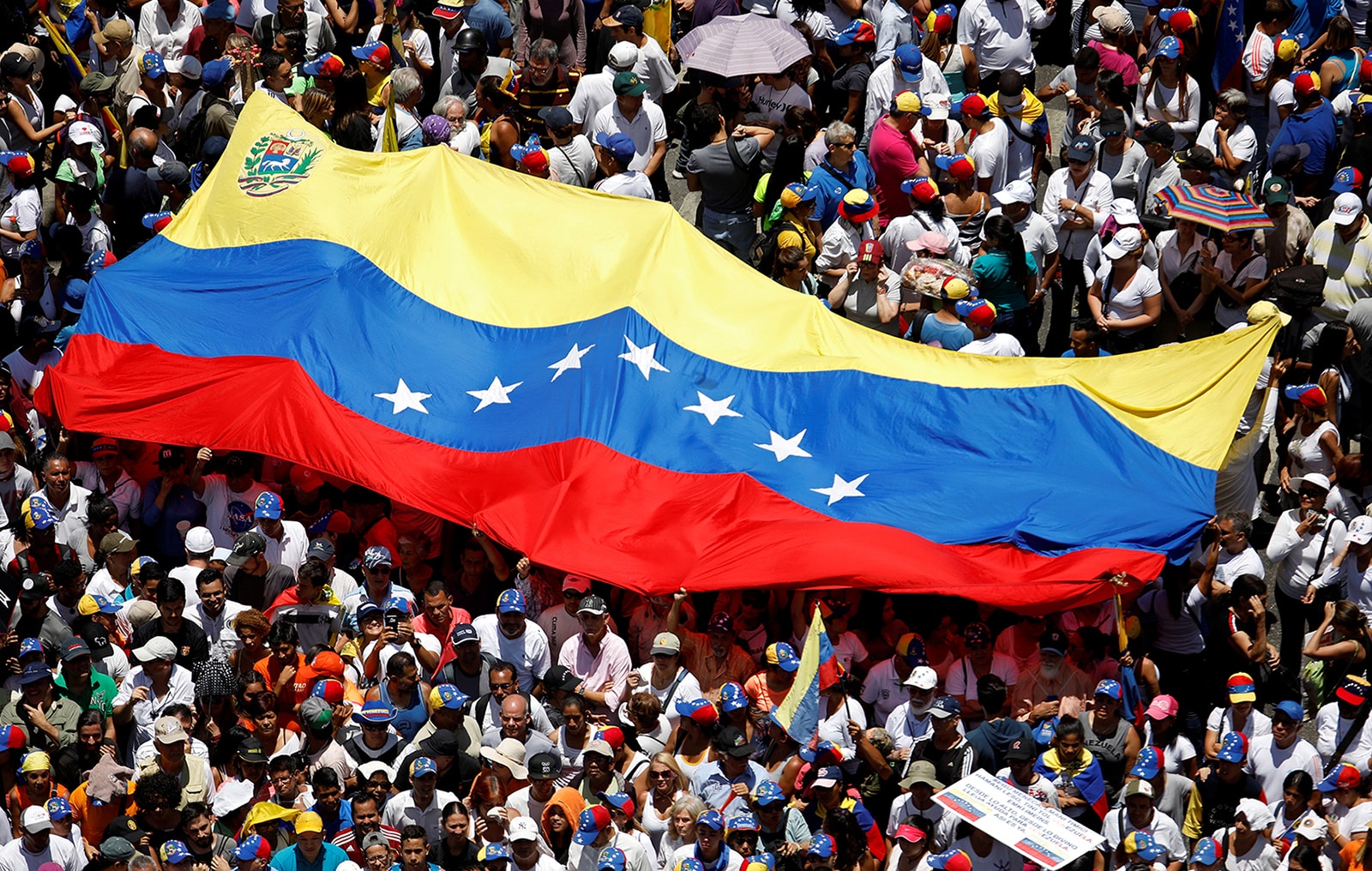 Venezuelan protest with country flag