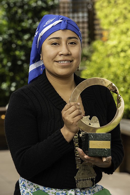 Belen Curamil Canio with the Goldman Environmental Prize she received on behalf of her father.