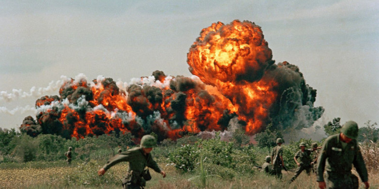Vietnam War US Napalm Strike A napalm strike erupts in a fireball near U.S. troops on patrol in South Vietnam, 1966 during the Vietnam War. (AP Photo)