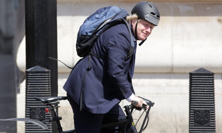 U.K. Prime Minister Boris Johnson cycling. 