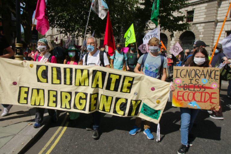 Extinction Rebellion protesters holding climate banner