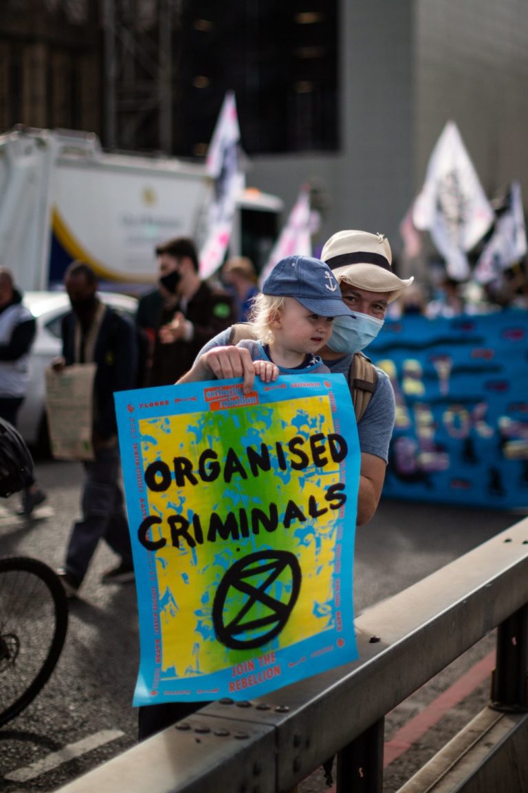 Extinction Rebellion protester holding poster