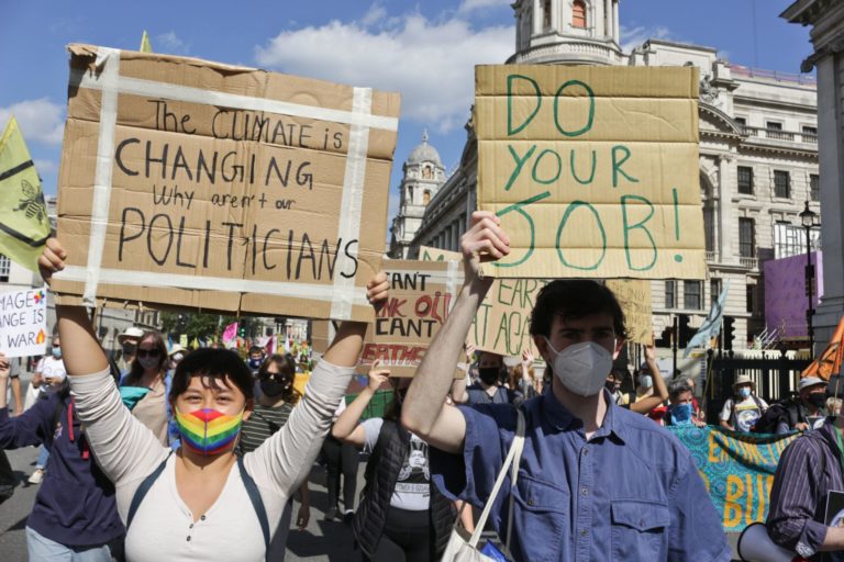 Extinction Rebellion protesters holding signs