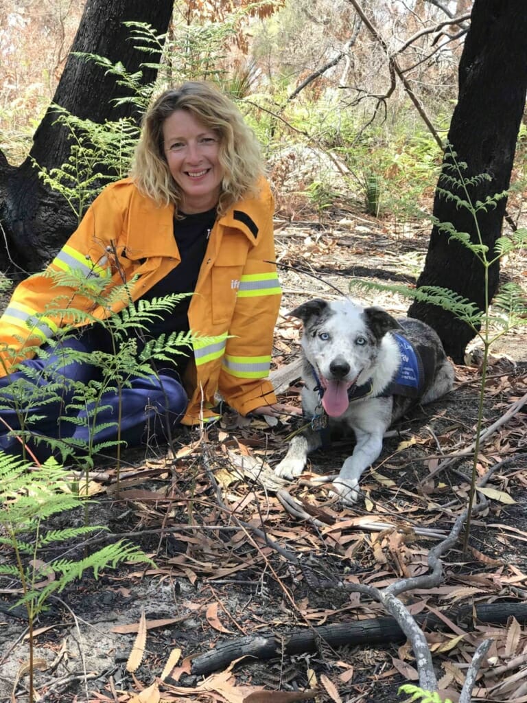 Josey Sharrad out in the wildlife with a rescue dog.