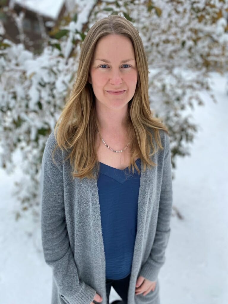 Jennifer Gardner, a woman in animal conservation, standing in the snow