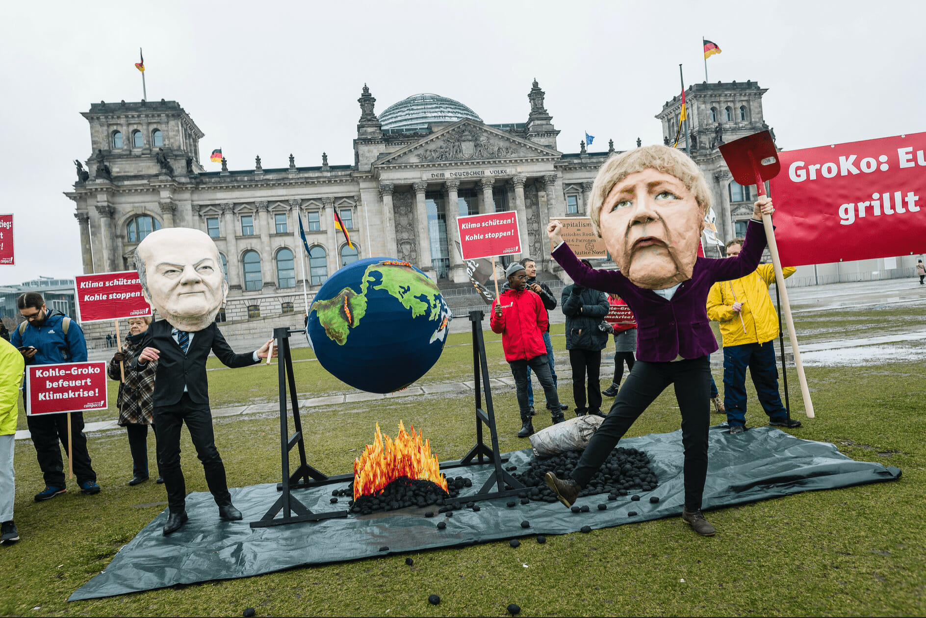climate activists protest Angela Merkel