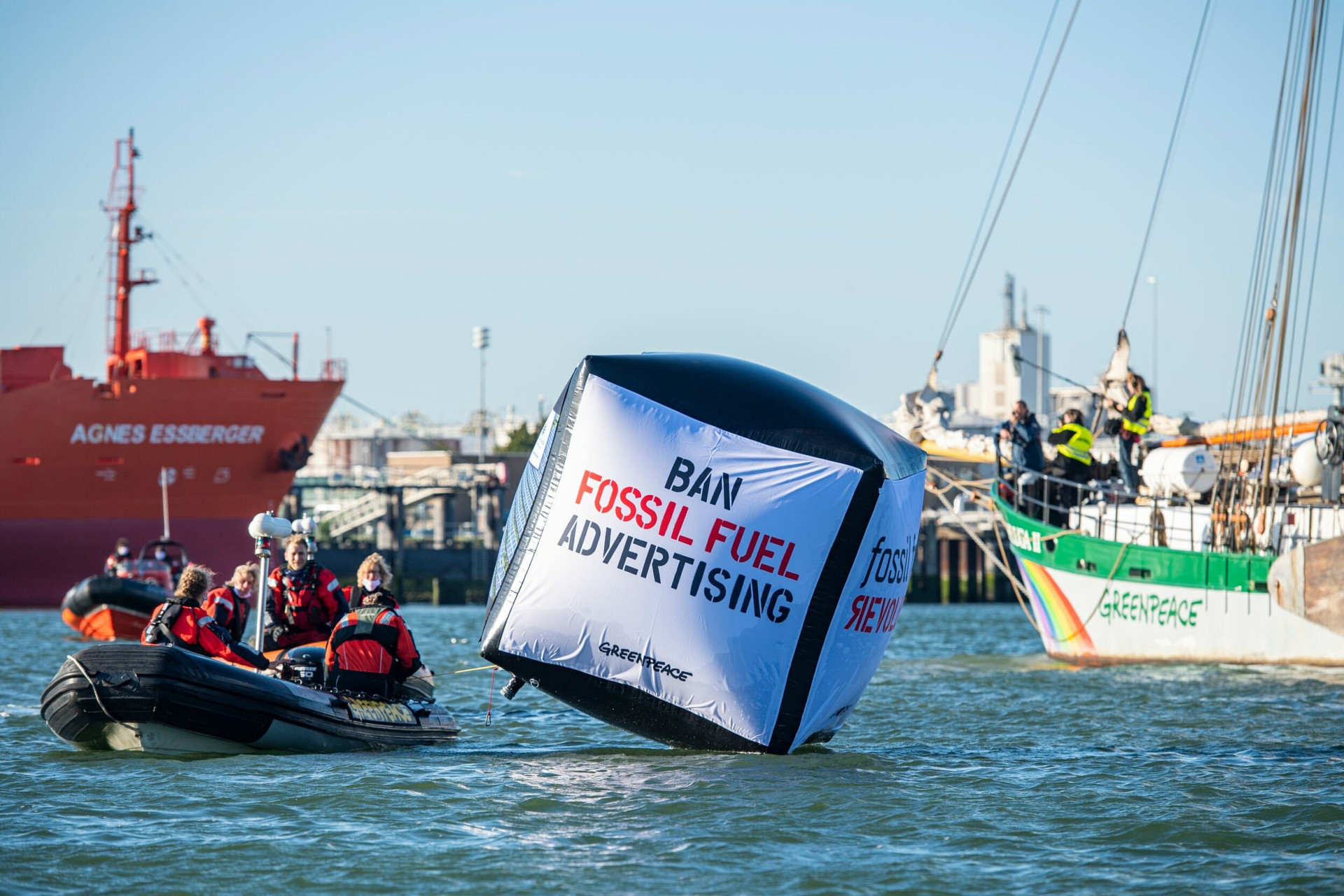 people on boat shell with greenwashing advert