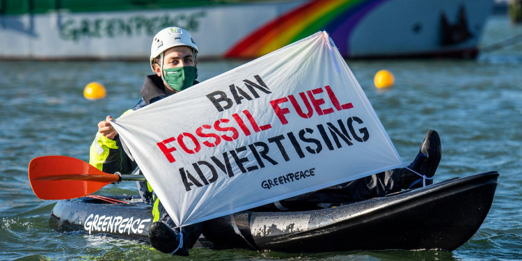 In the Photo: More than 80 Greenpeace Netherlands activists from 12 EU countries are using fossil fuel ads from all over Europe to block the entrance to Shell’s oil refinery. The peaceful protest comes as over 20 organizations launched a European Citizens’ Initiative (ECI) petition today, calling for a new law that bans fossil fuel advertising and sponsorship in the European Union. Photo Credit: © Marten van Dijl / Greenpeace.