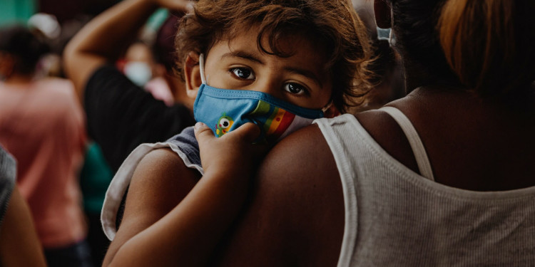 small boy with a mask during the covid-19 pandemic in poverty