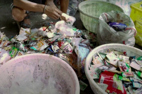Clutter of coloured plastic sachets in Indonesia