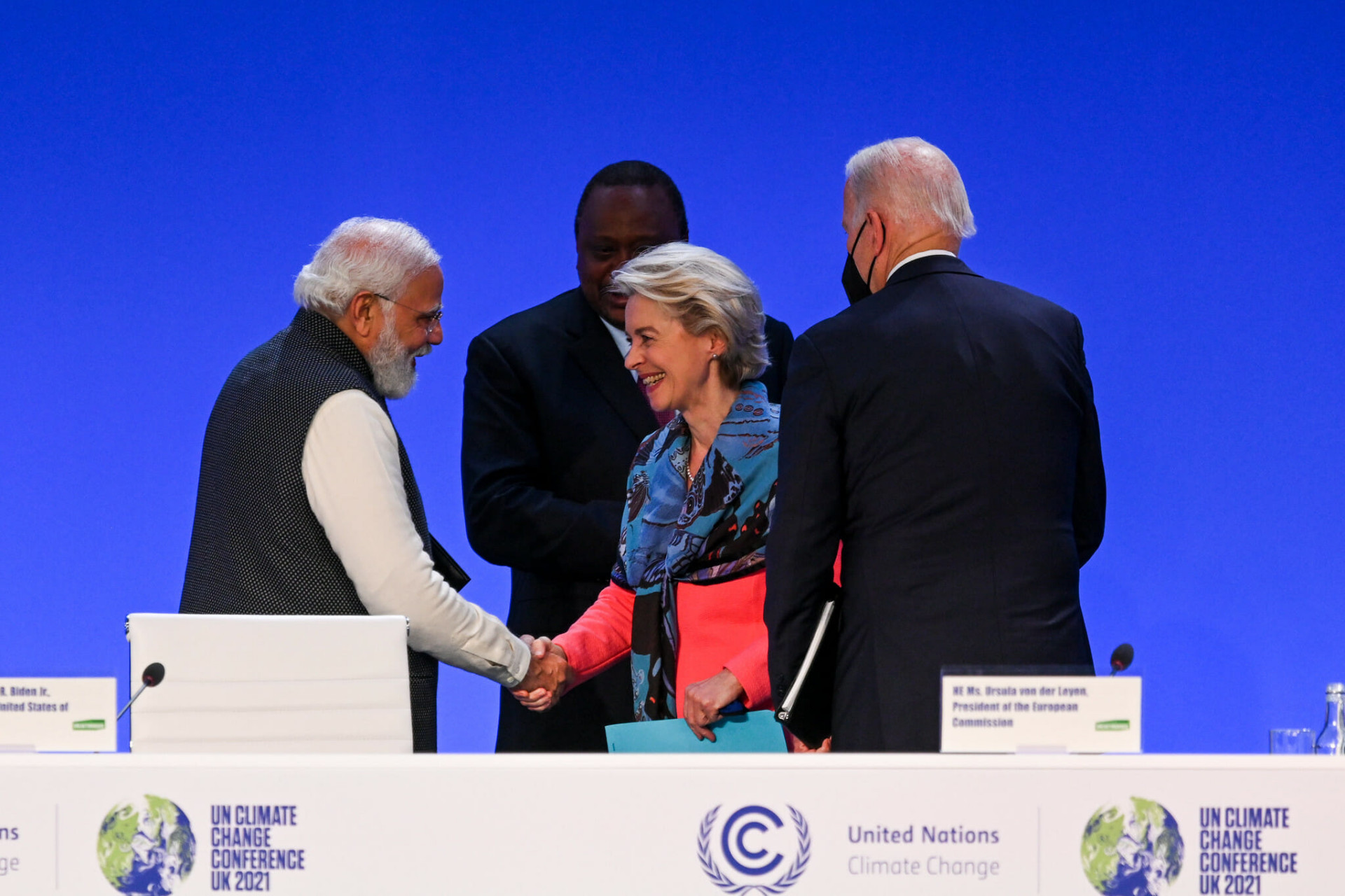 people shaking hands at COP26