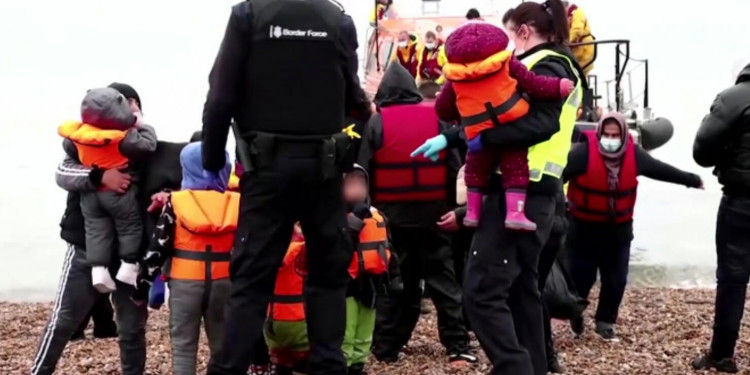 migrants brought ashore