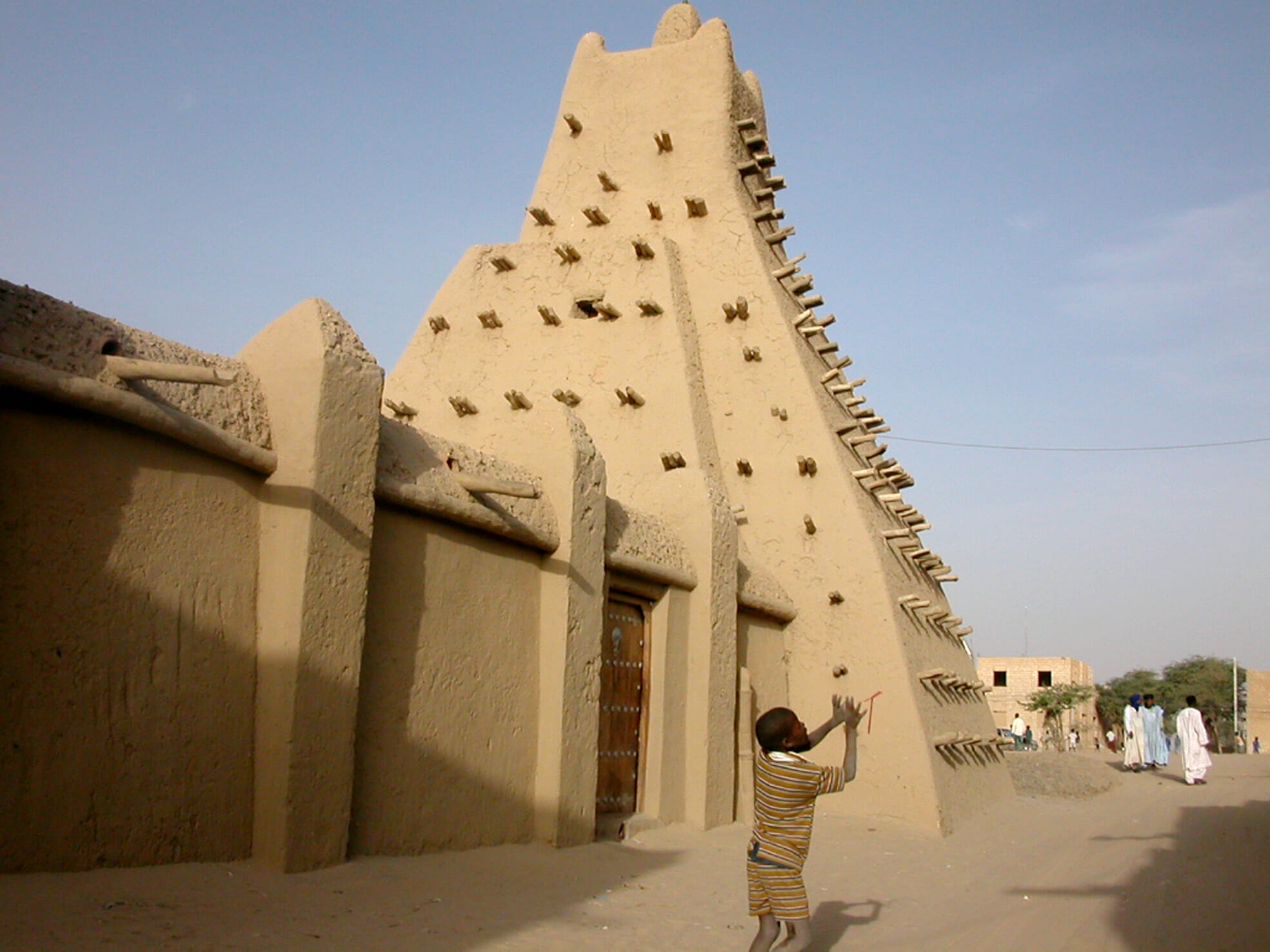 boy in front of mausoleum