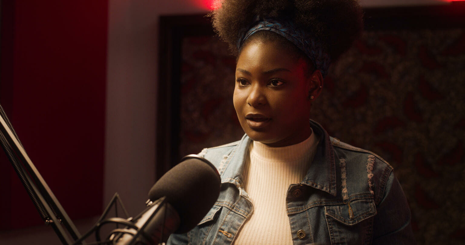 girl speaking to a microphone