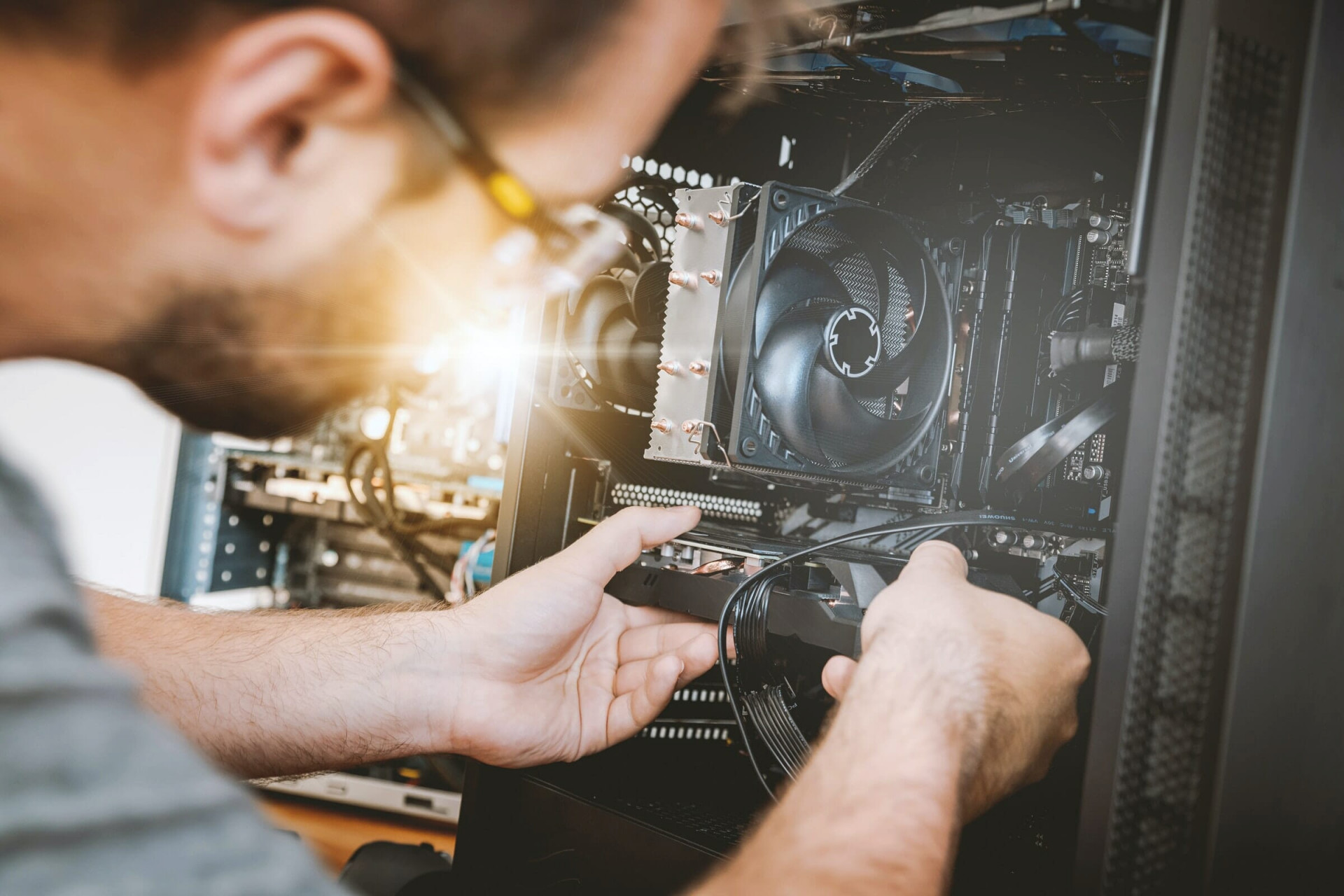 person doing work on a machine