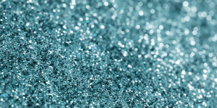 A glittery blue coloured surface background
