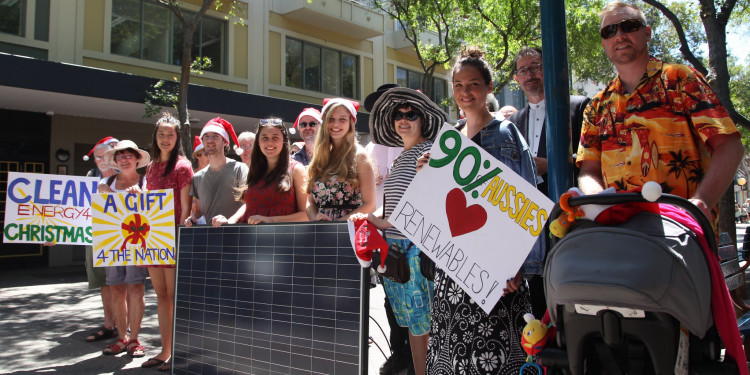 Australian citizens deliver solar panels as part of a Christmas gift to former Prime Minister Tony Abbott on December 15, 2014.