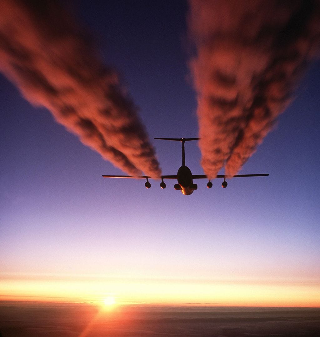 A plane emitting carbon dioxide into the atmosphere