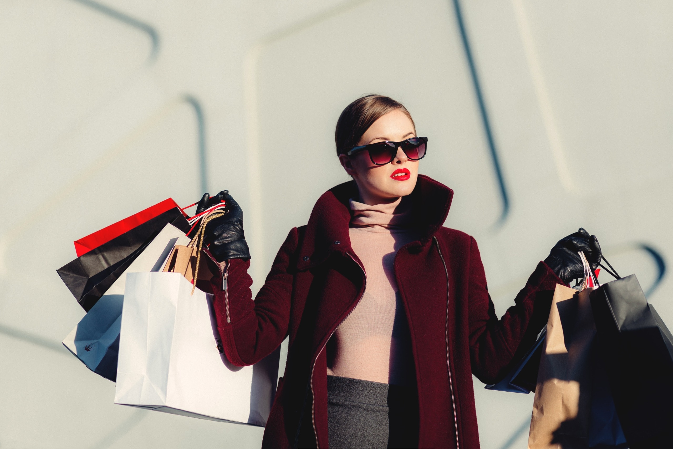A woman holding shopping bags.