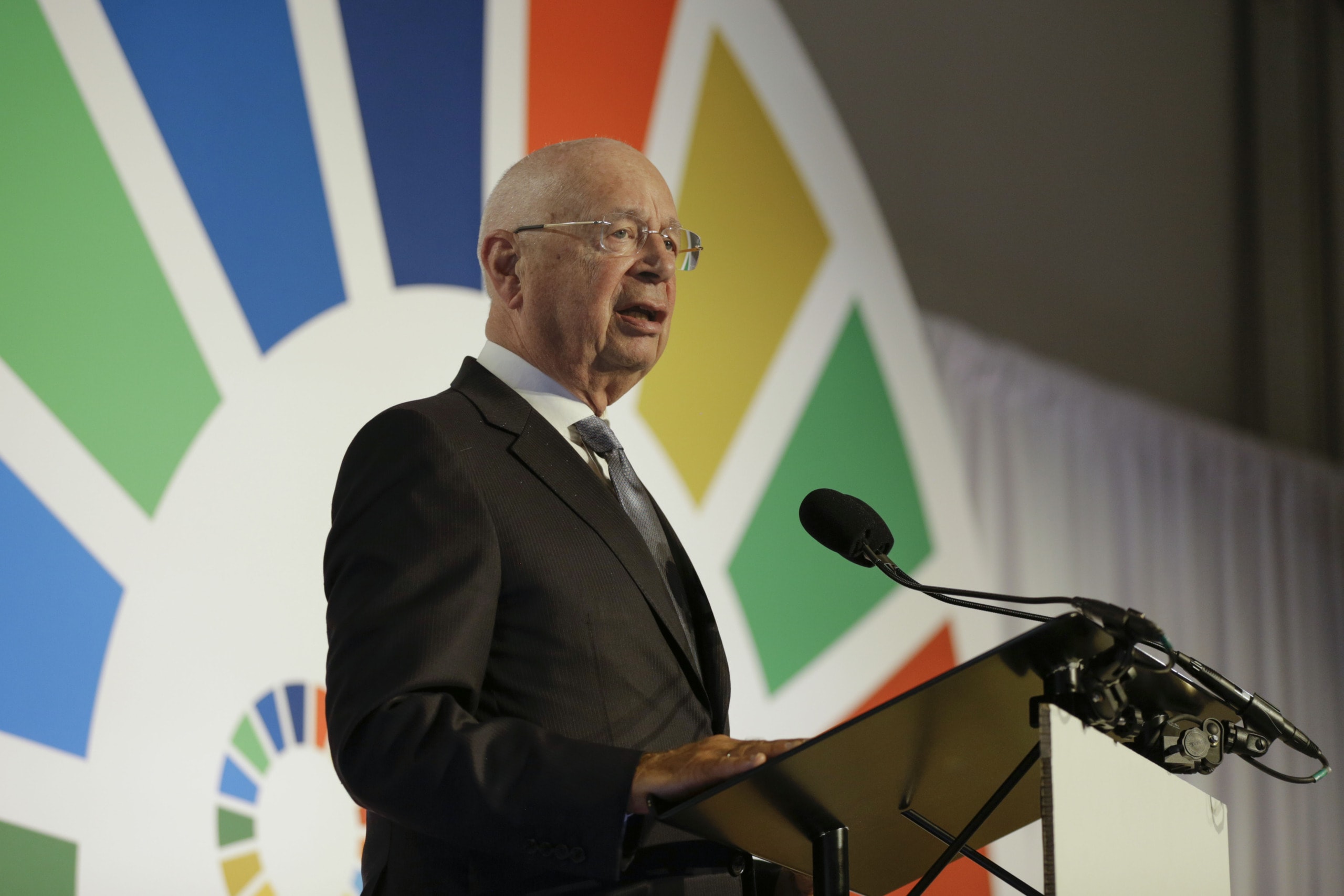 Professor Klaus Schwab talking at a World Economic Forum (WEF) gathering