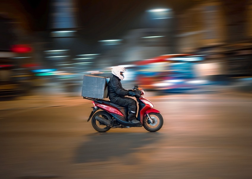 Rider on motorbike last-mile delivery solution