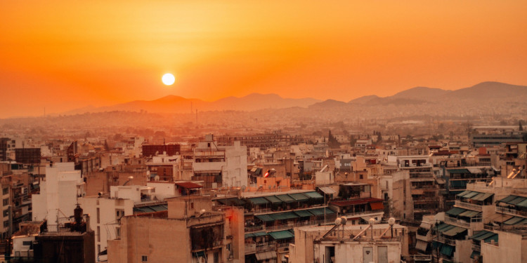 A densely packed urban area in Athens, Greece at sunset