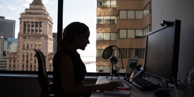 A woman sitting at her desk