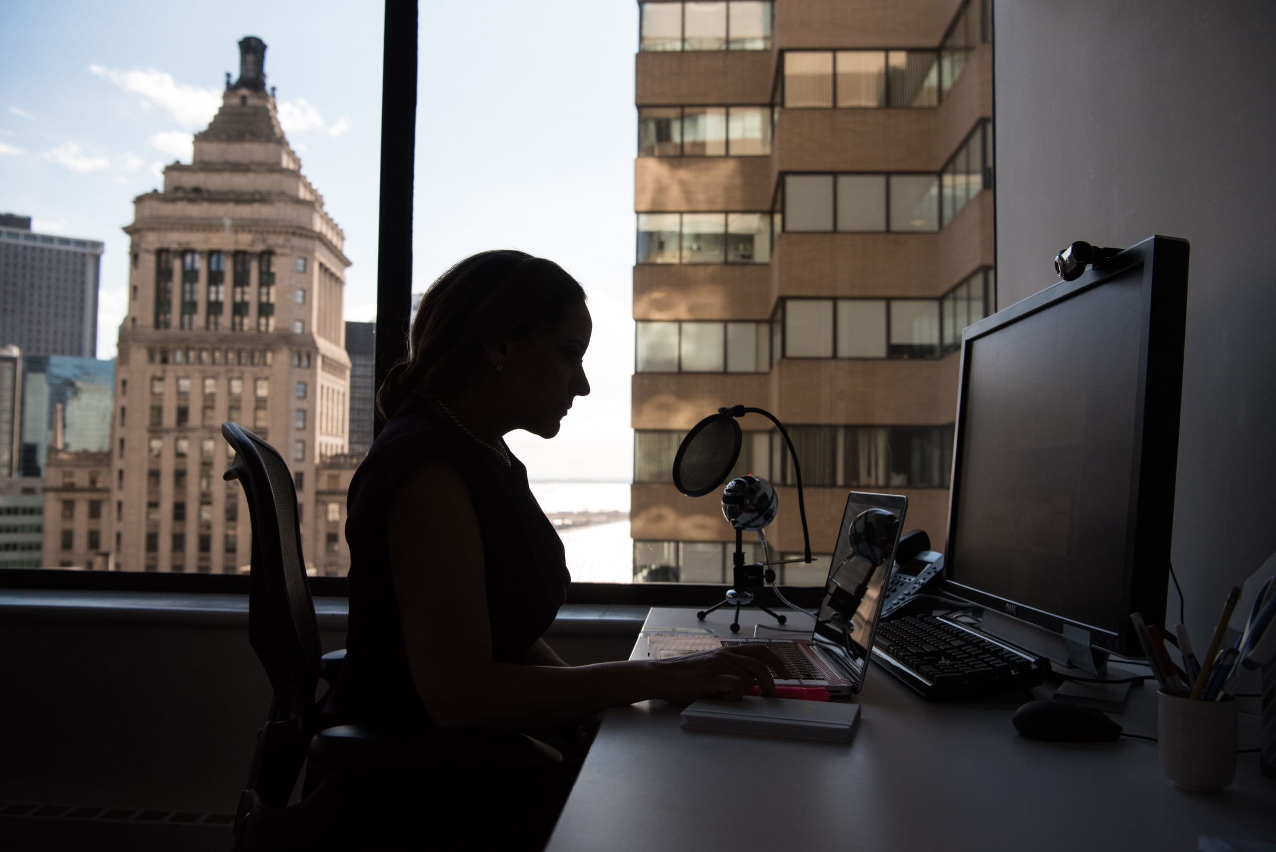 A woman sitting at her desk
