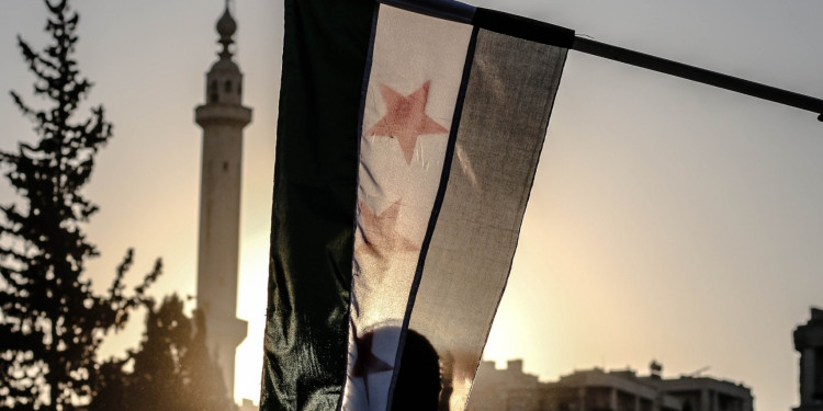 Syrian flag next to a mosque. Ahmed Akacha