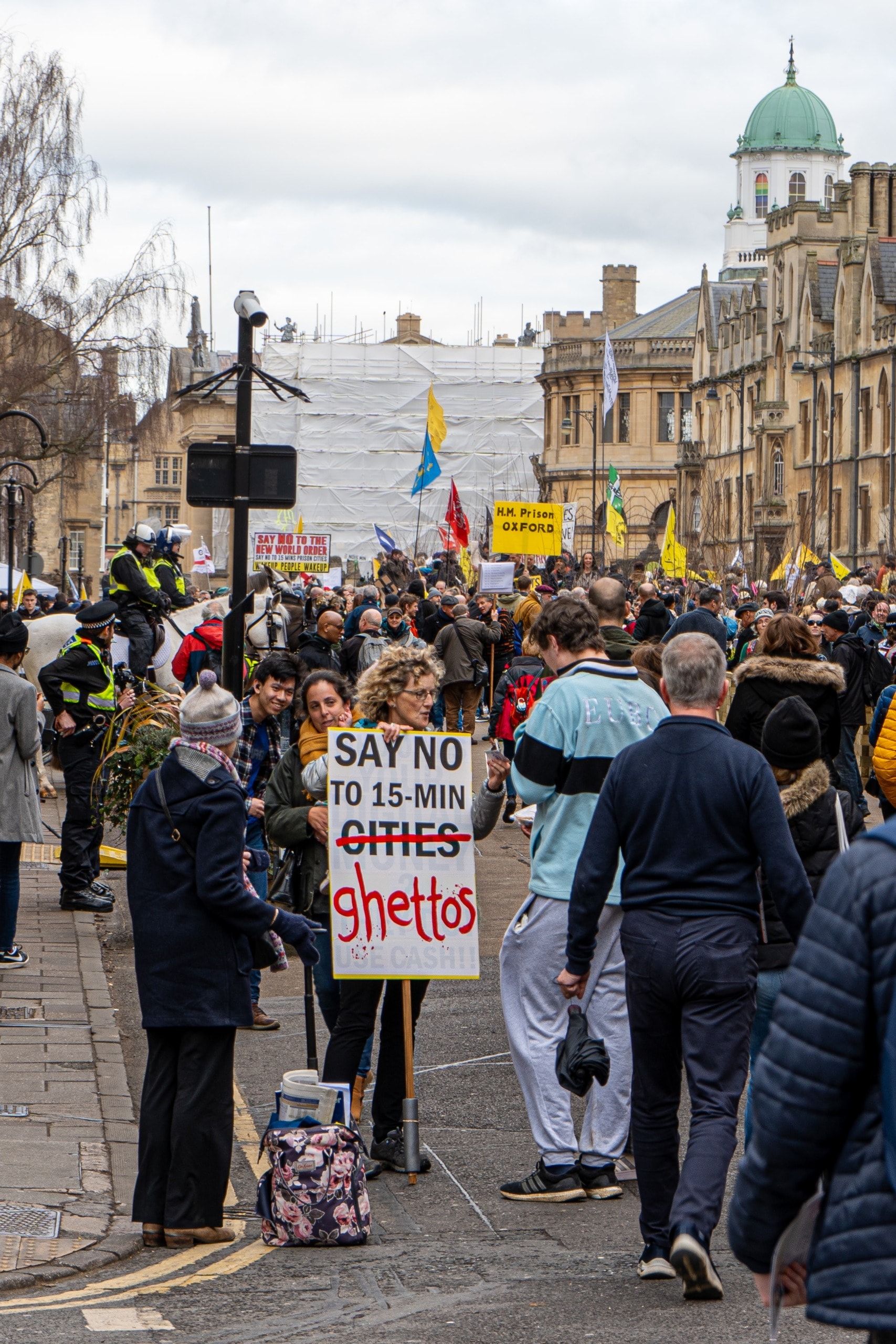 Signs displaying the various conspiracy theories related to the 15-minute city