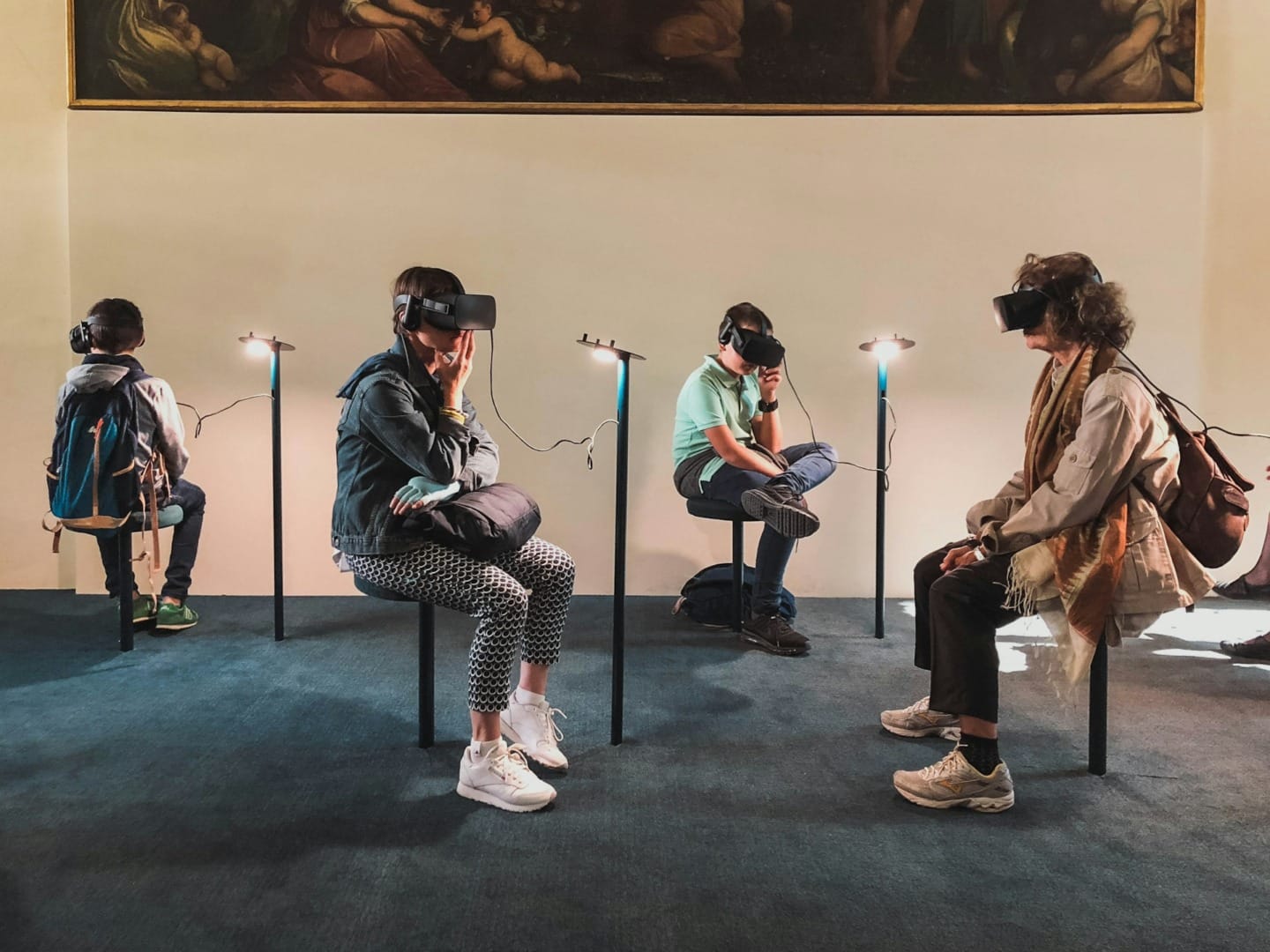 People in a museum using virtual reality headsets. Tech trends to look out for in 2024