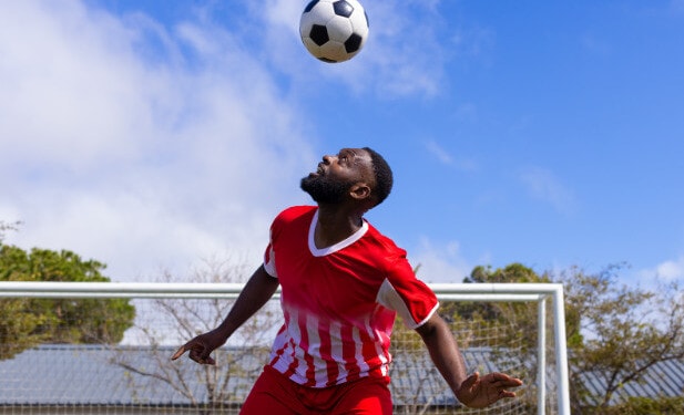 player bouncing a ball on his head