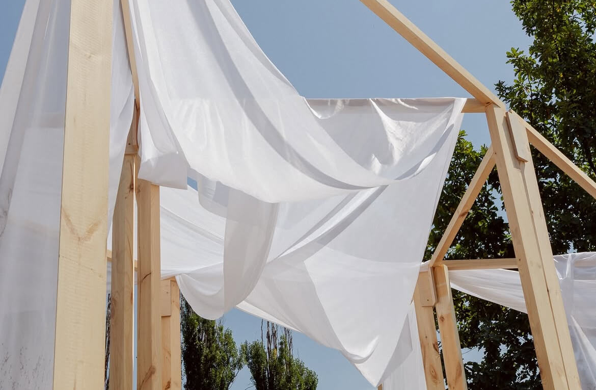 Young designers presenting sustainable prototypes at Creathon 2025 in Almaty’s Botanical Garden.