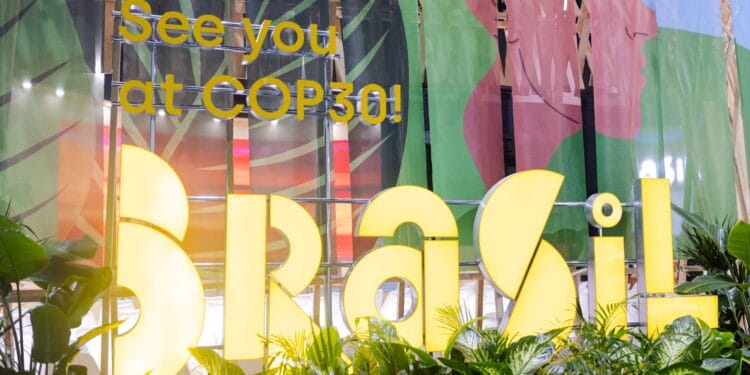 A lighted sign reads, "See you at COP30! Brasil"