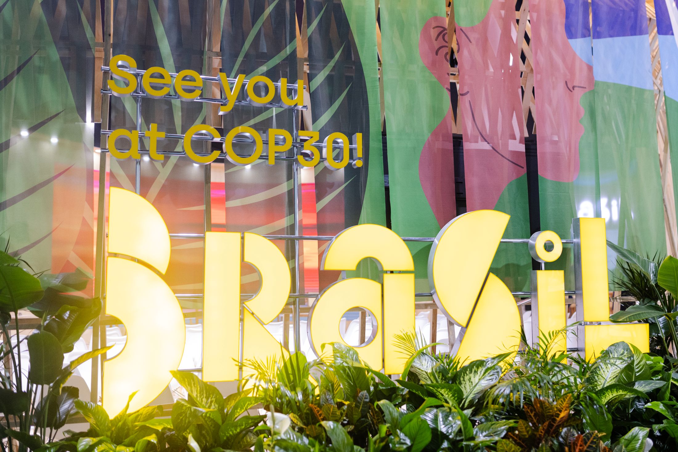 A lighted sign reads, "See you at COP30! Brasil"